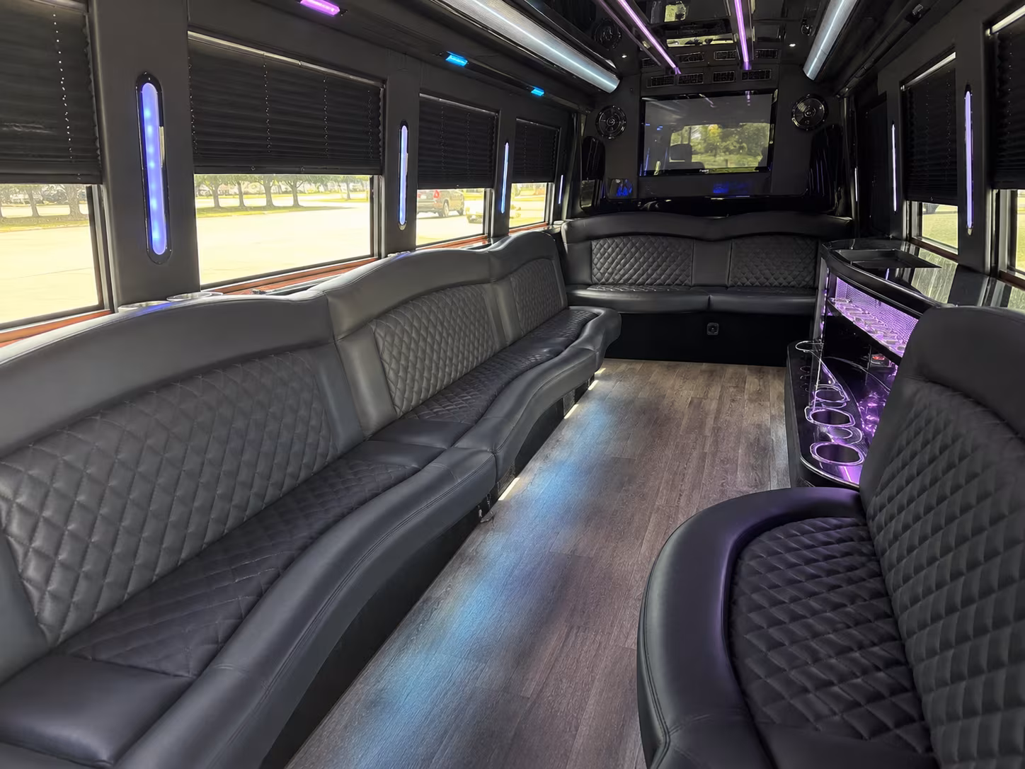 Wedding guests seated inside a party bus serving Orlando
